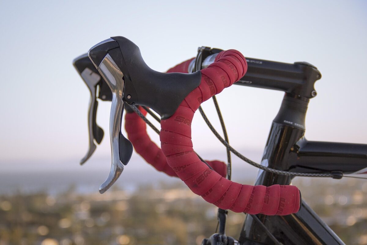 A light bracket clamped to a handlebar