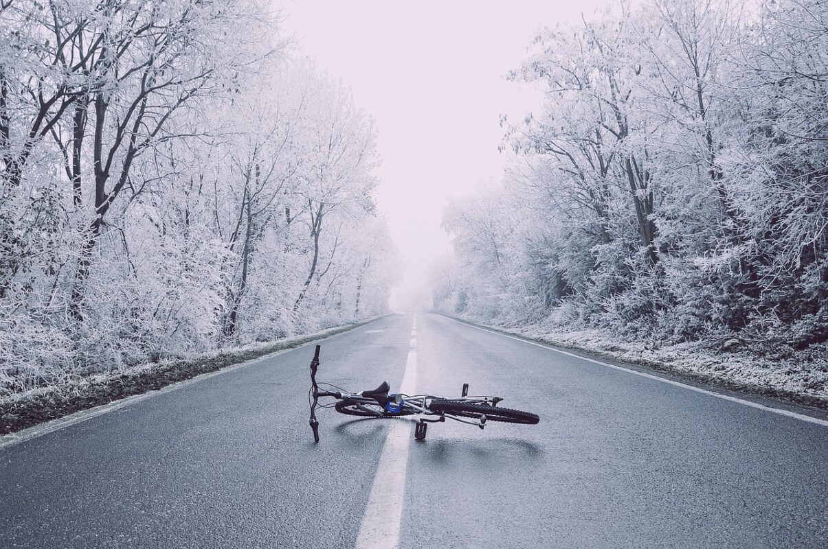A bicycle on a winter road at dusk