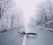 A bicycle on a winter road at dusk