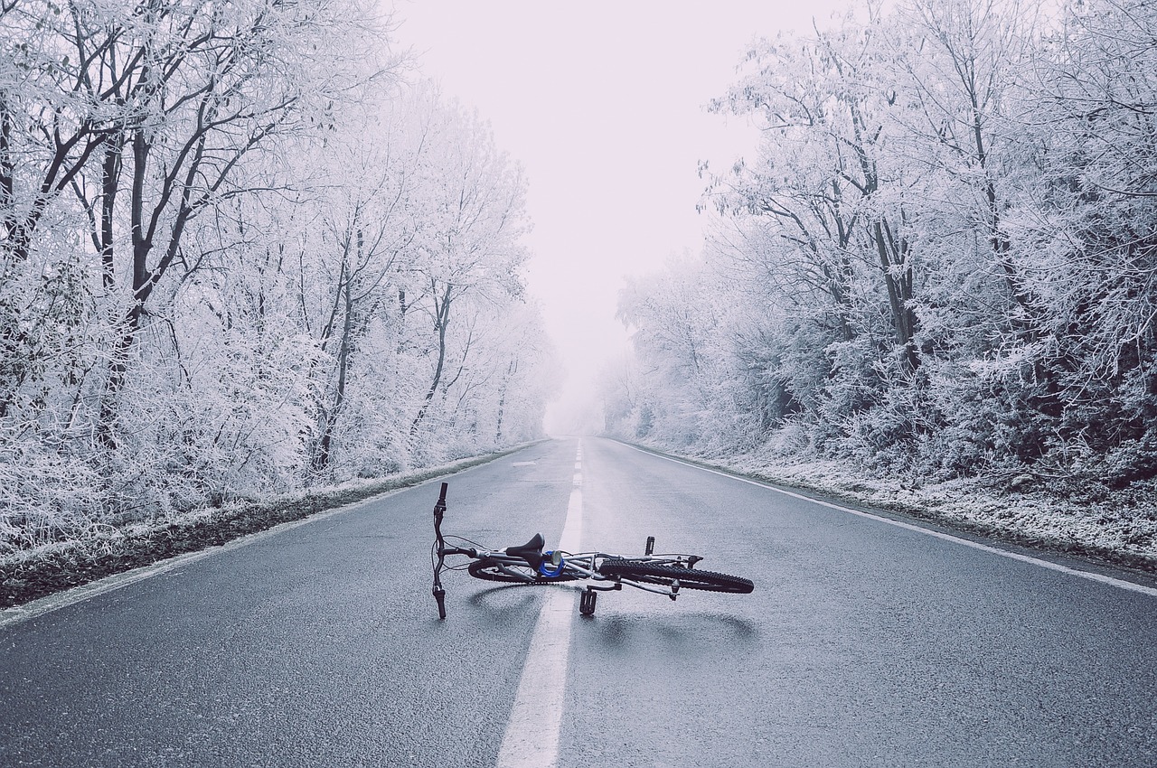 A bicycle on a winter road at dusk